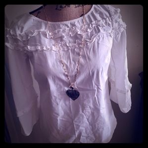 White blouse with ruffle details